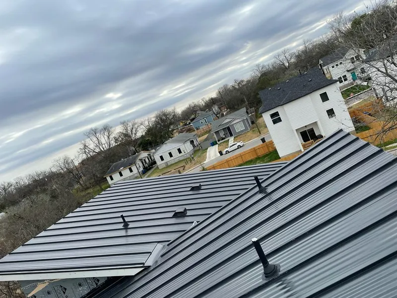Standing seam metal roof panels with vents for Skylight Repair in Alton